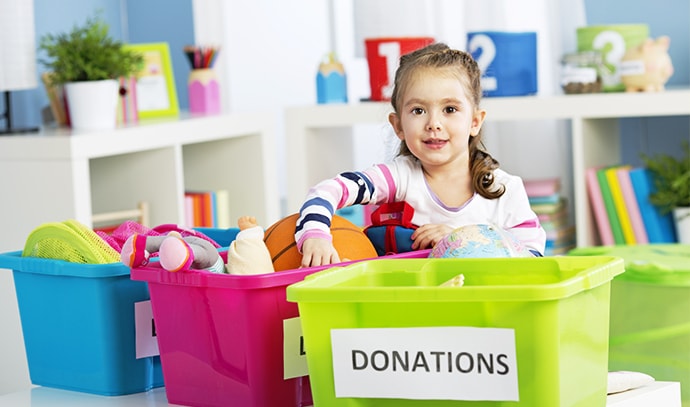 kid-organising-her-toys-for-donation-stuffed-toys